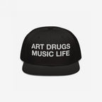 Black snapback cap with flat brim featuring “ART DRUGS MUSIC LIFE” in bold white embroidery, embodying creative expression and chaos. Perfect for those who embrace art, music, and an unapologetic lifestyle.