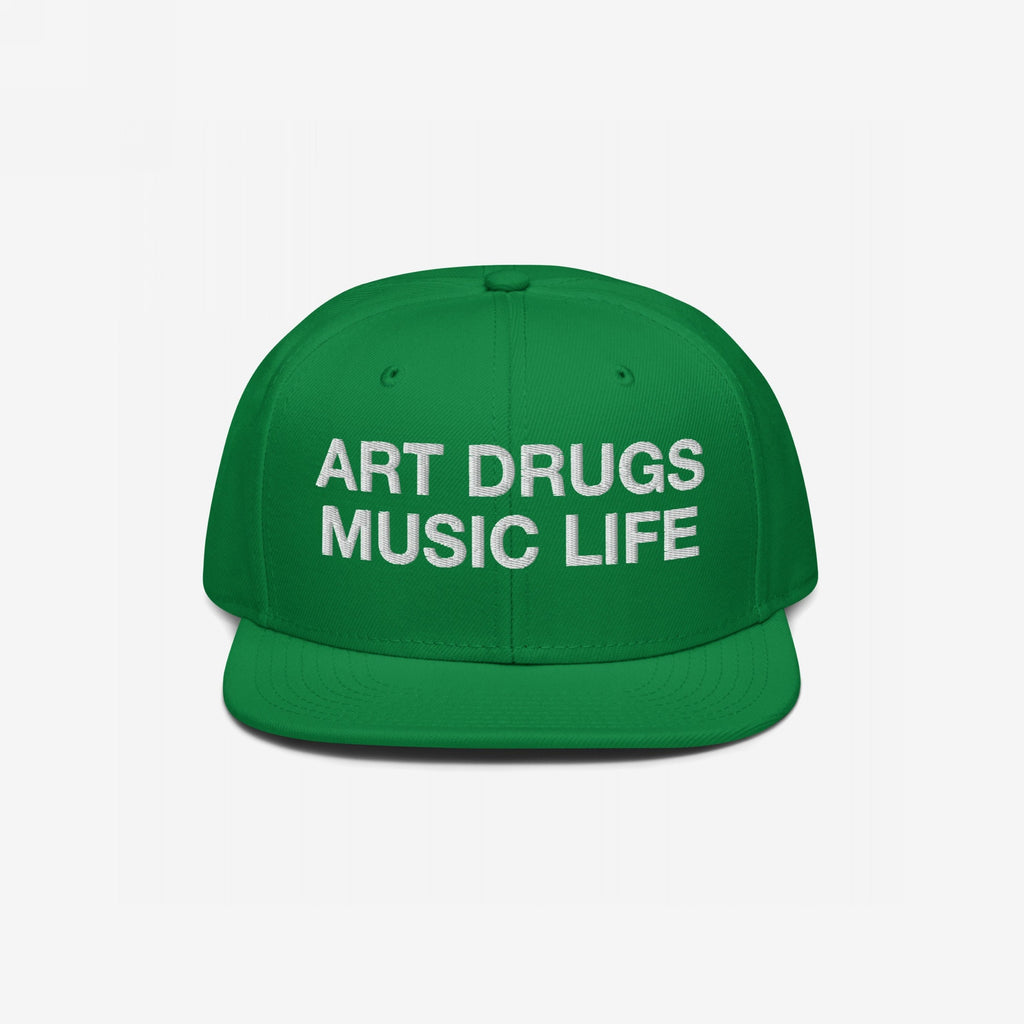 Green snapback hat with white embroidered “ART DRUGS MUSIC LIFE” text, embodying creative rebellion and expression. Perfect for art, music, and life enthusiasts seeking bold, unapologetic style.