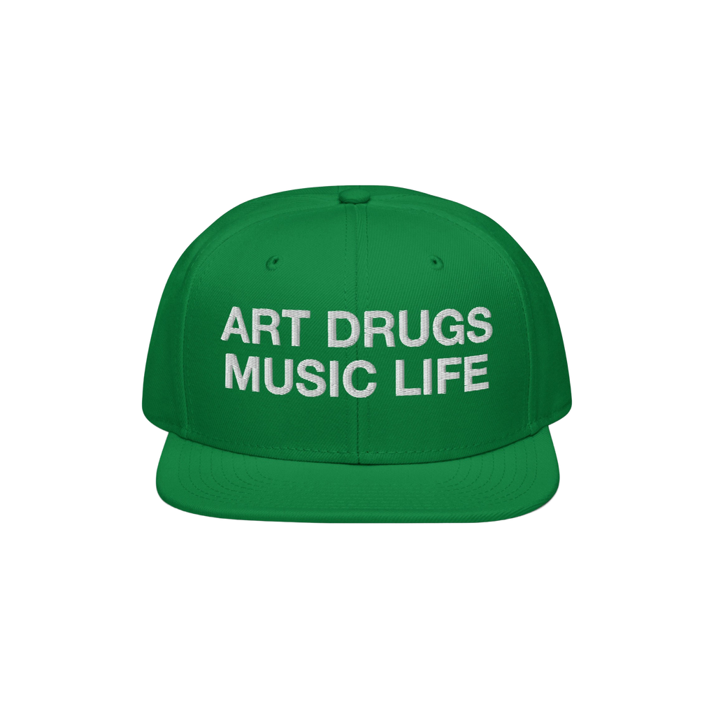 Green snapback hat with white embroidered “ART DRUGS MUSIC LIFE” text, embodying creative rebellion and expression. Perfe