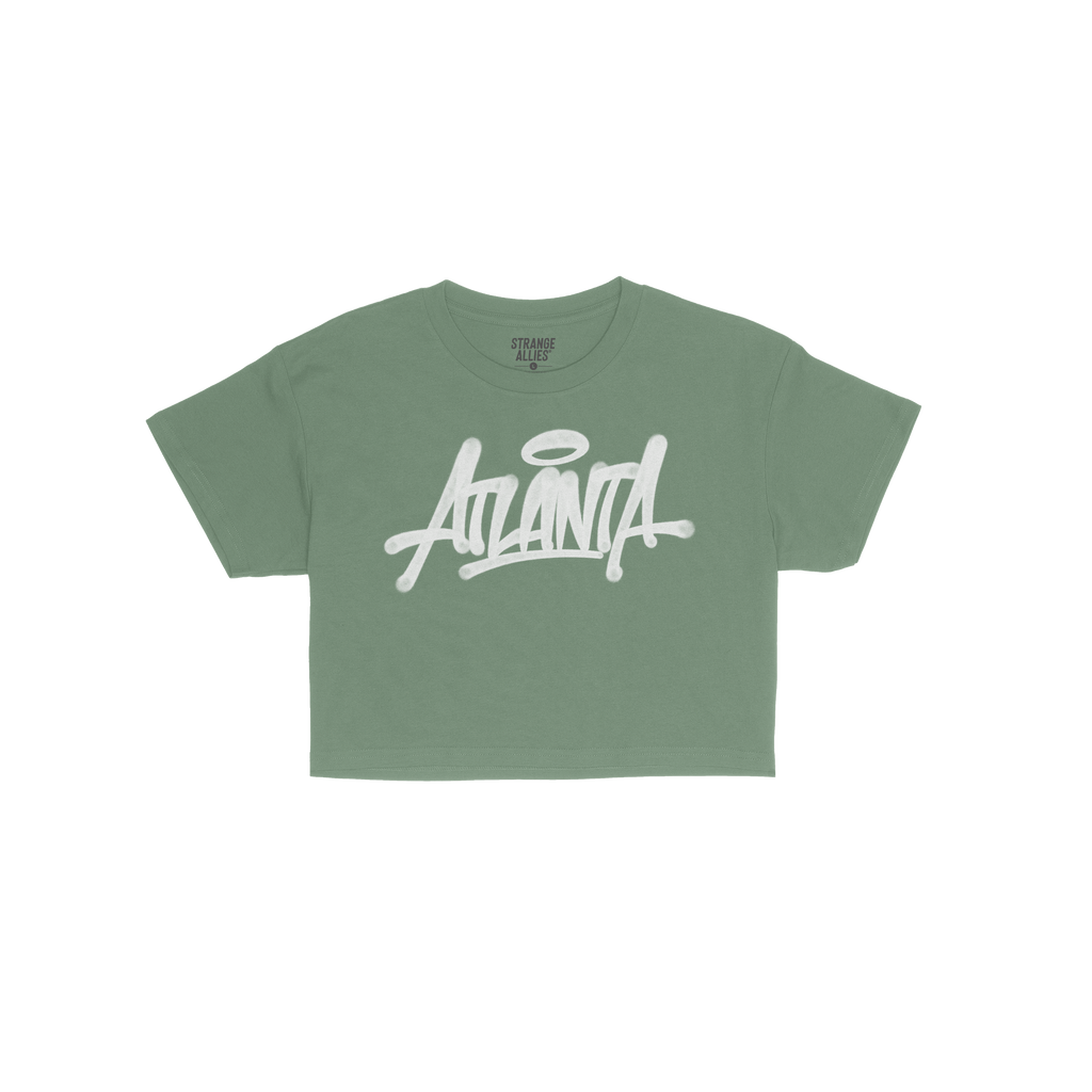 Atlanta Handstyle Women's Baby Tee featuring a white graffiti-style ANIMAL wordmark on a plain green, short-sleeved T-shirt, 