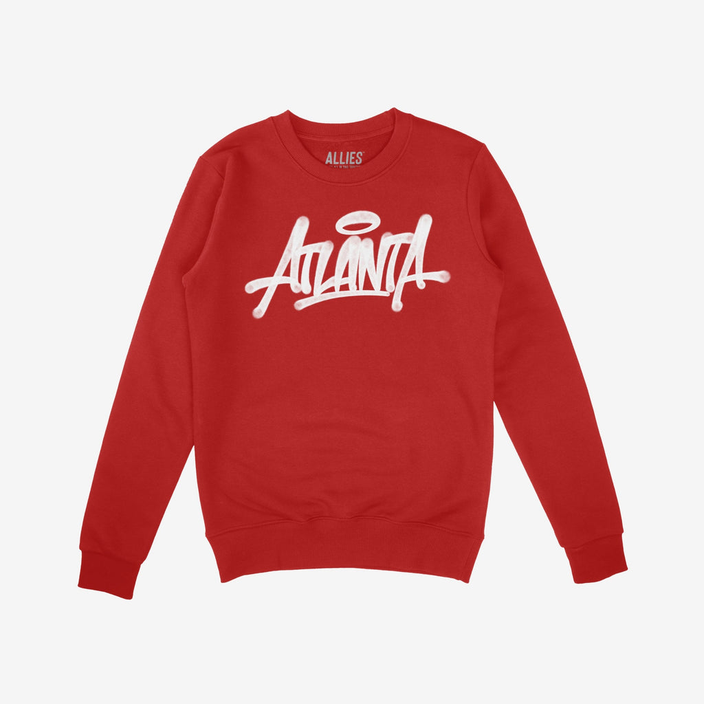 Red crew-neck sweatshirt featuring ATLANTA in white graffiti-style script with a halo over the A. The Atlanta Handstyle Hoodie & Sweatshirt showcases bold city pride and urban art influence.