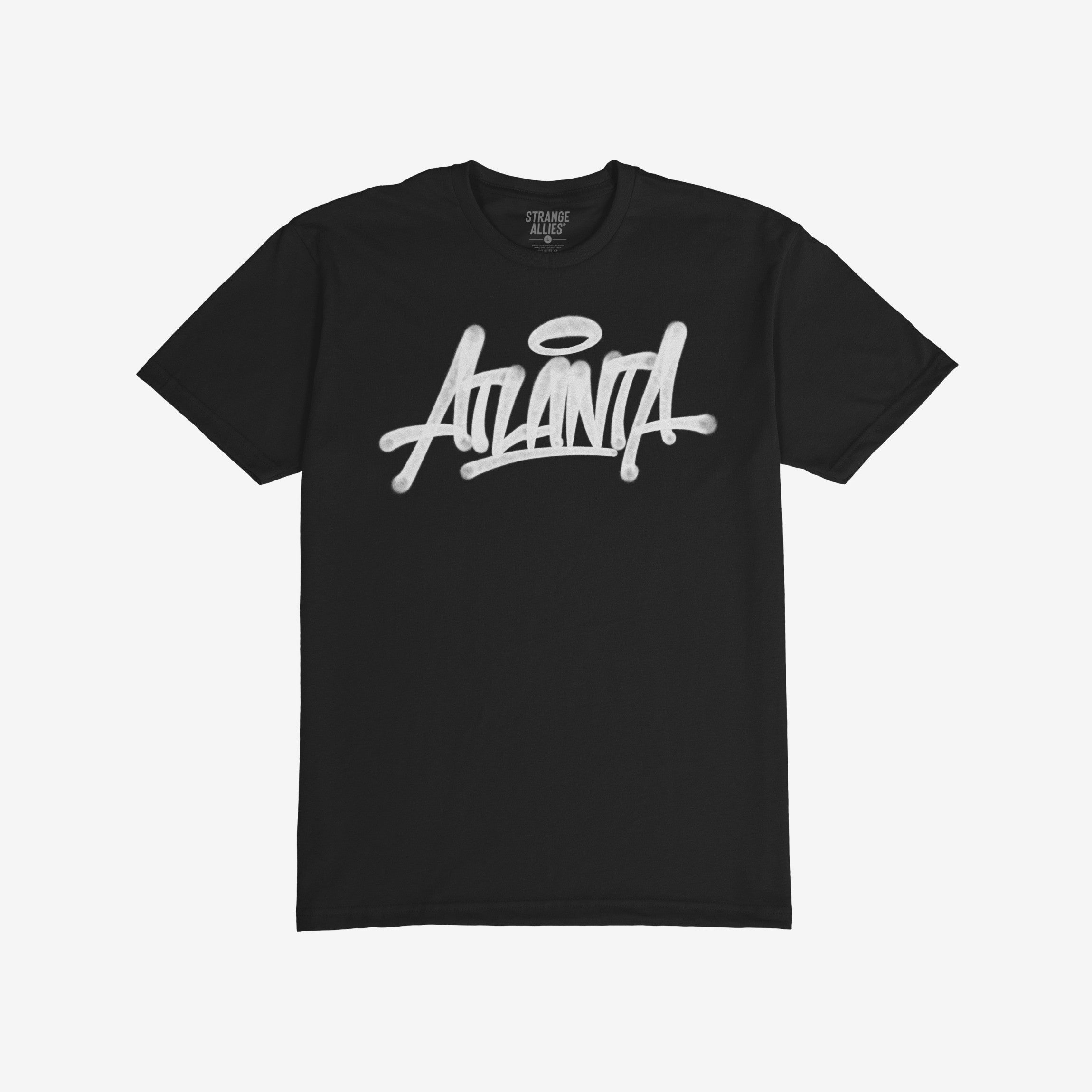 Atlanta Handstyle T-shirt featuring a graffiti-style Atlanta logo with a halo accent, reflecting street art culture. The brand Strange Allies is visible inside the neckline.