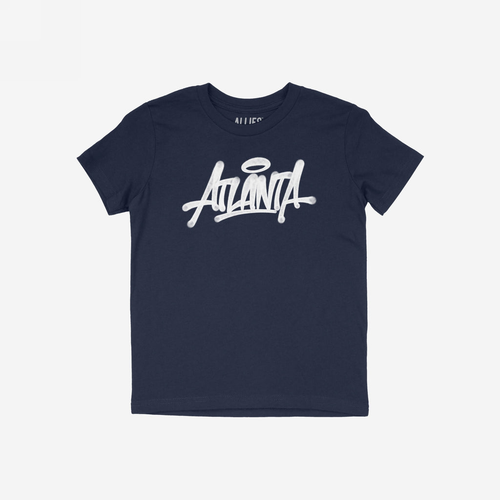 Atlanta Handstyle T-shirt features a navy-blue crewneck with “Atlanta” in white graffiti script and a halo over the “A”, embodying street art culture and city pride.