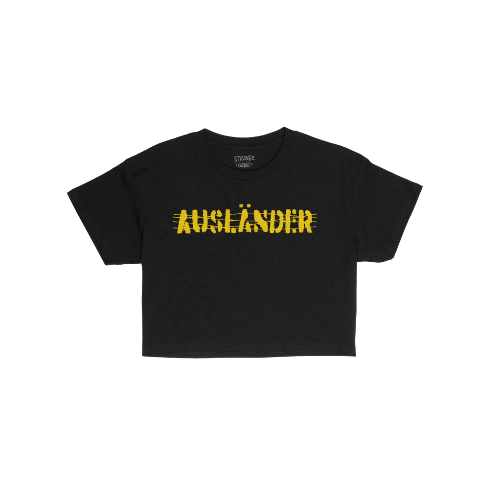 Ausländer Women's Baby Tee features AUSLÄNDER in bold, yellow hand-drawn–style font across the chest, embodying a stateme
