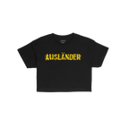 Ausländer Women's Baby Tee features AUSLÄNDER in bold, yellow hand-drawn–style font across the chest, embodying a stateme
