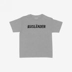 Ausländer Women's Baby Tee features a bold graphic of the word AUSLÄNDER struck through, symbolizing defiance. This tight, cropped tee reclaims identity with style and strength.