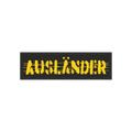 Ausländer Sticker & Magnet featuring a distressed, stencil-style AUFZÄNDER design on a black banner. The background shows a