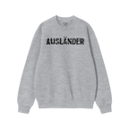 Light-gray long-sleeve crewneck sweatshirt with AUSLÄNDER in distressed black print across the chest, representing empowerme