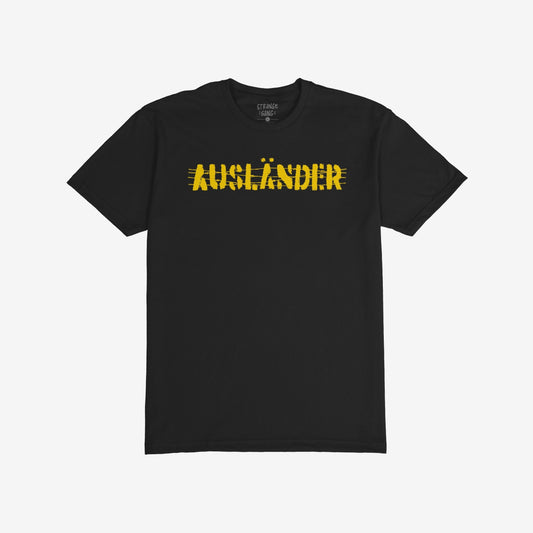 Ausländer T-shirt features a distressed yellow graphic that boldly reclaims the term across the chest, with a small interior label, symbolizing resistance and empowerment against oppressive systems.