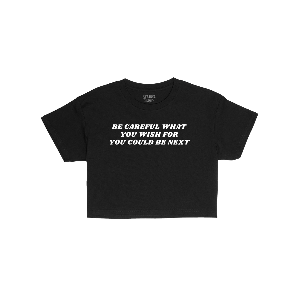 Black cropped T-shirt with bold white text: “Be careful what you wish for, you could be next.” The Be Careful Women's Bab