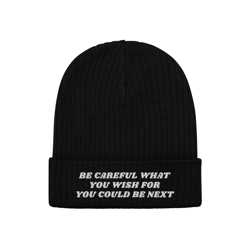 Black rib-knit cuffed beanie featuring white embroidery with the text Be Careful What You Wish For You Could Be Next, alignin