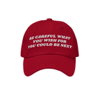 Red six-panel baseball cap featuring the bold phrase “BE CAREFUL WHAT YOU WISH FOR YOU COULD BE NEXT,” embodying a progre