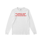 White long-sleeve Be Careful Shirt with a bold red slogan: “BE CAREFUL WHAT YOU WISH FOR YOU COULD BE NEXT”, symbolizing 
