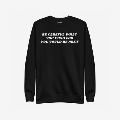 Black crewneck sweatshirt with bold white lettering, Be Careful What You Wish For, You Could Be Next, reflecting the Be Careful Hoodie & Sweatshirt's edgy, rebellious stance against authoritarianism.