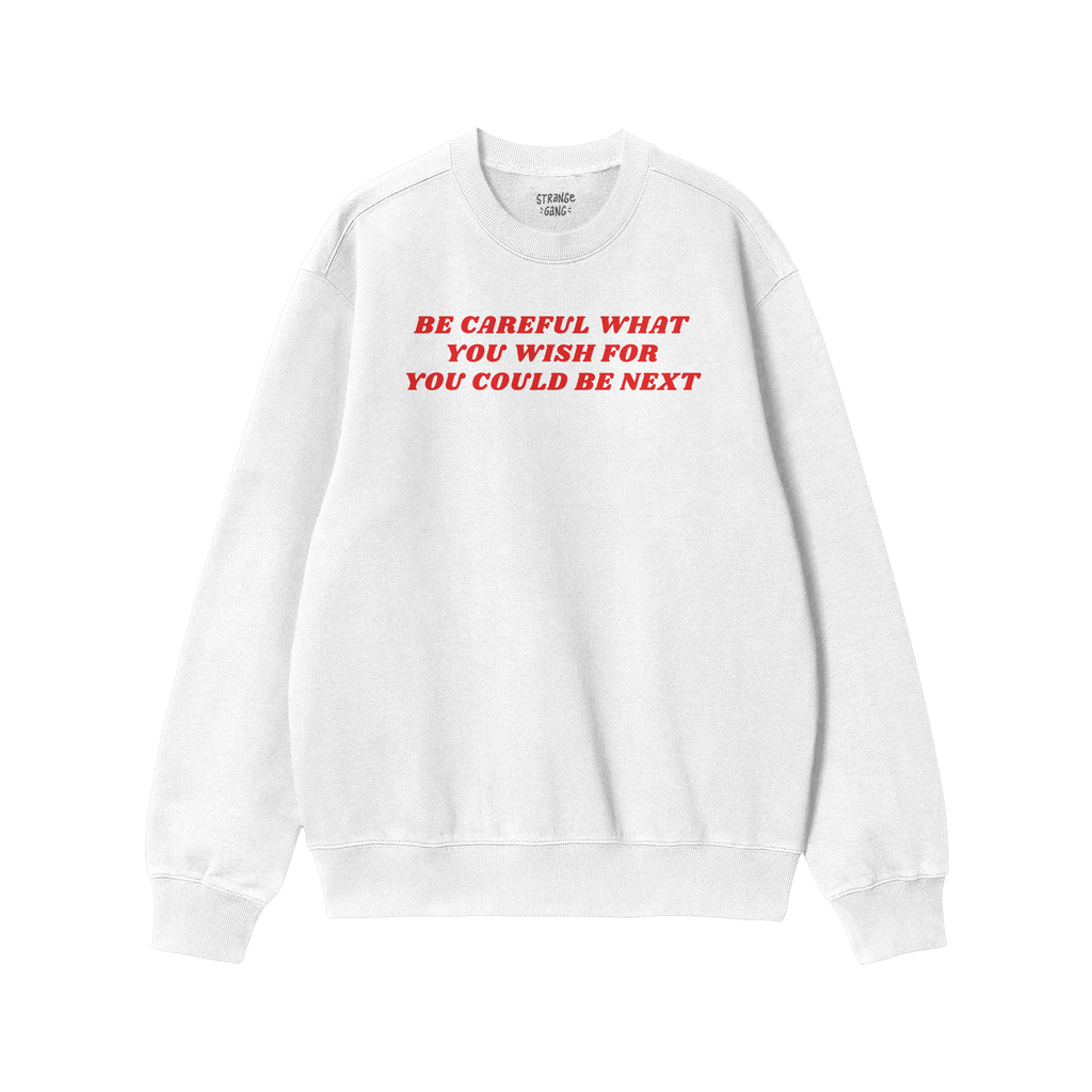 White crew-neck sweatshirt featuring bold red text: BE CAREFUL WHAT YOU WISH FOR YOU COULD BE NEXT. The Be Careful Shirt chal