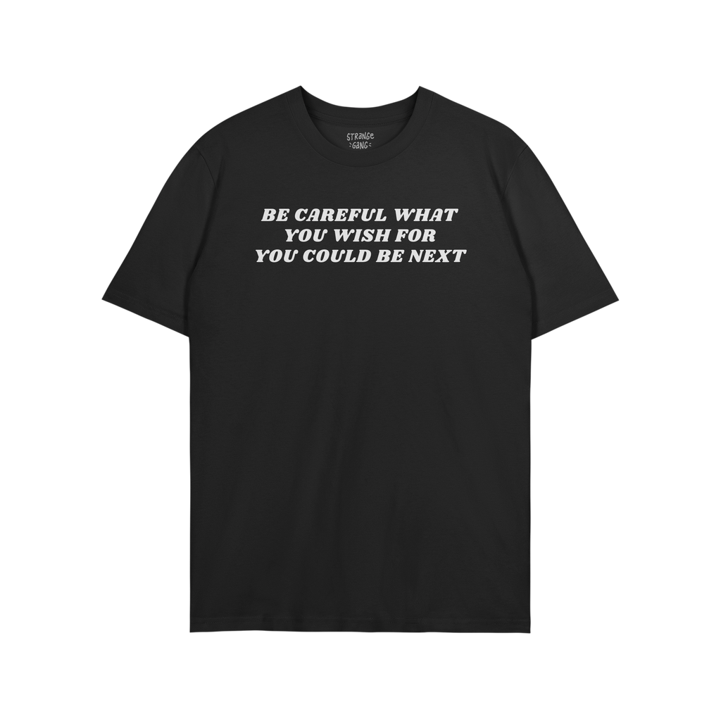 Black T-shirt featuring the bold slogan BE CAREFUL WHAT YOU WISH FOR YOU COULD BE NEXT in white text. Ideal for advocating ag
