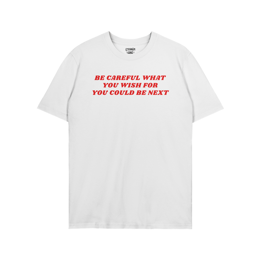 The Be Careful Shirt features bold red text warning against authoritarianism, printed on a white crew-neck T-shirt. Inside th