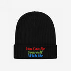 Black rib-knit Be Yourself Hat with a folded cuff, featuring You Can Be Yourself With Me embroidered in red, green, and blue, embodying inclusivity and self-expression.