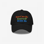 Black Be Yourself Hat with vibrant embroidery reading You Can Be Yourself With Me, reflecting a message of acceptance and individuality.