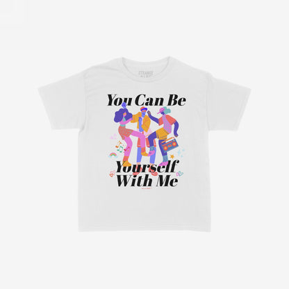The Be Yourself T-shirt features a bold graphic with dancing figures and a boombox, surrounded by joyful symbols, promoting authenticity and inclusivity with the slogans “You Can Be” and “Yourself With Me.”
