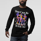 The Be Yourself Shirt features vibrant abstract figures with musical notes and stars on a black long-sleeve tee, promoting self-expression and inclusivity.