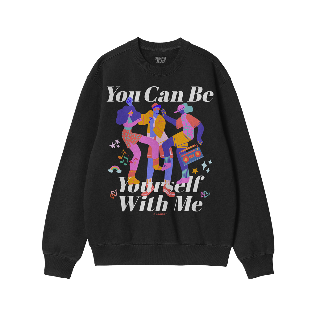 The Be Yourself Shirt features vibrant figures dancing with musical notes and symbols, and the empowering slogan “You Can B