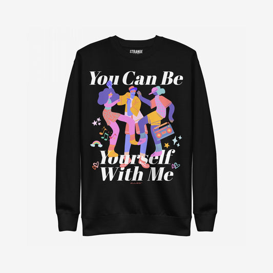 Be Yourself Sweatshirt featuring a vibrant illustration of three dancing figures with musical notes, stars, and hearts, and the phrase “You Can Be Yourself With Me,” symbolizing inclusivity and pride.