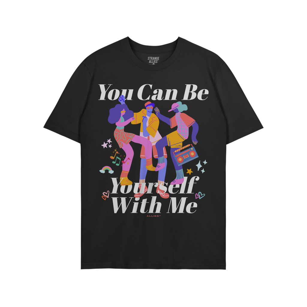 The Be Yourself Shirt features a vibrant illustration of three dancers, one with a boombox, surrounded by stars, hearts, musi
