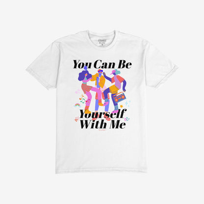 The Be Yourself T-shirt features three dancing figures with a boombox, surrounded by musical notes, hearts, and stars, and bold text promoting self-expression and inclusivity.