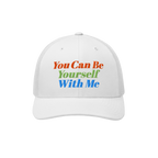 The Be Yourself Hat features a white trucker-style cap with bold embroidery that reads, You Can Be Yourself With Me, embodyin