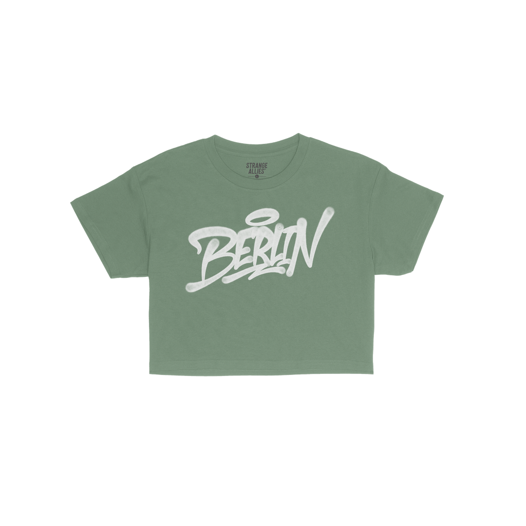 Berlin Handstyle Women's Baby Tee featuring a bold, graffiti-inspired “BERLIN” graphic in white spray-paint style across 