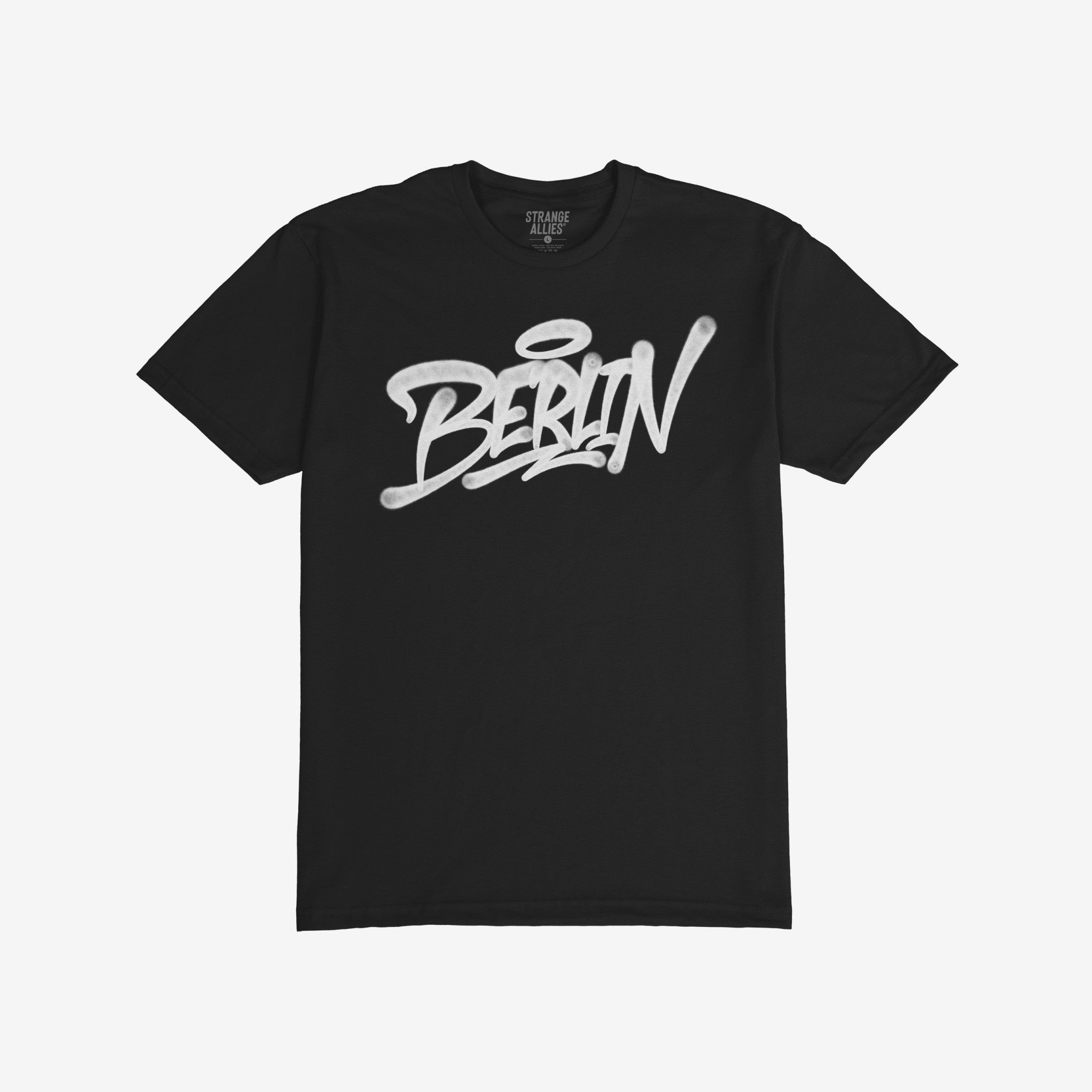 Berlin Handstyle T-shirt features bold white graffiti script Berlin on a plain black tee, embodying urban street art style. The Strange Allies label is visible at the neck.
