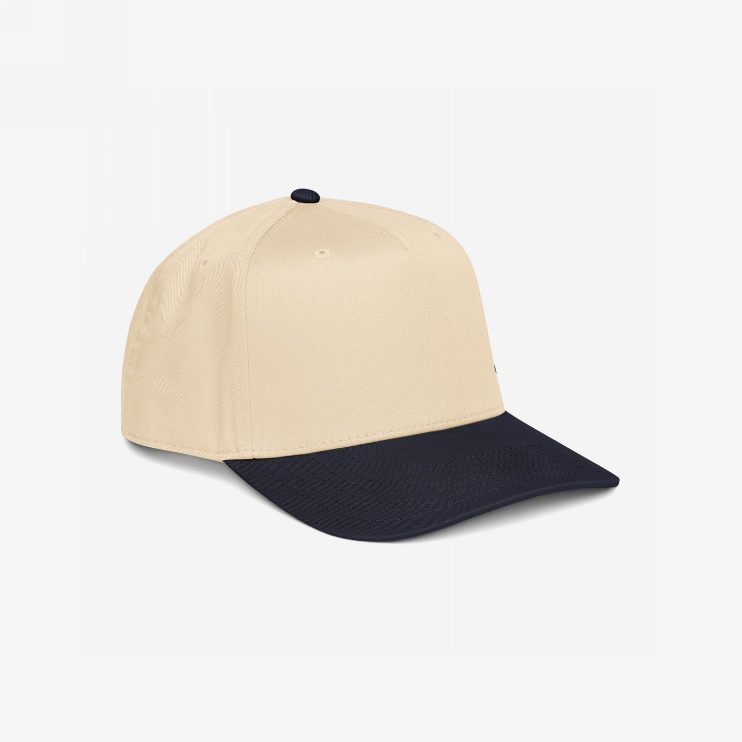 5-Panel Hat In Custom Colors: A beige crown with a navy bill and button, displayed against a white background, ready for custom political or activist embroidery. Ideal for outspoken individuals.