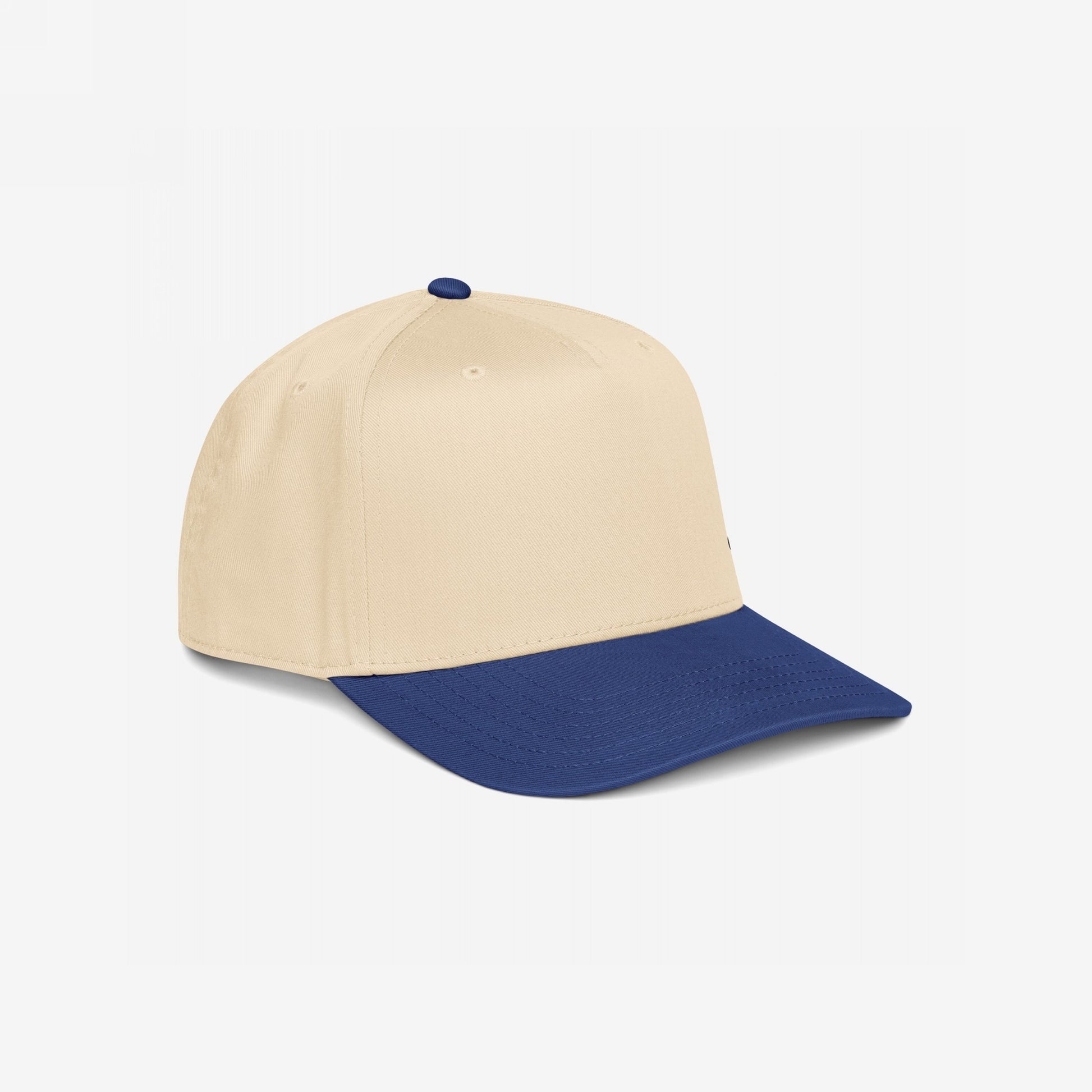 5-Panel Hat In Custom Colors: A two-tone baseball cap with a light cream crown and deep blue bill, offering a blank canvas for personalized, powerful, political embroidery. Ideal for outspoken activists and organizers.