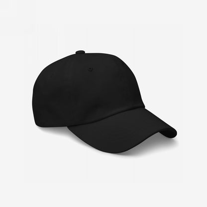 The image displays the Dad Hat In Custom Colors, a plain black baseball cap with a low-profile crown and curved brim, ideal for anti-fascist embroidery, made from soft chino cotton with adjustable strap.
