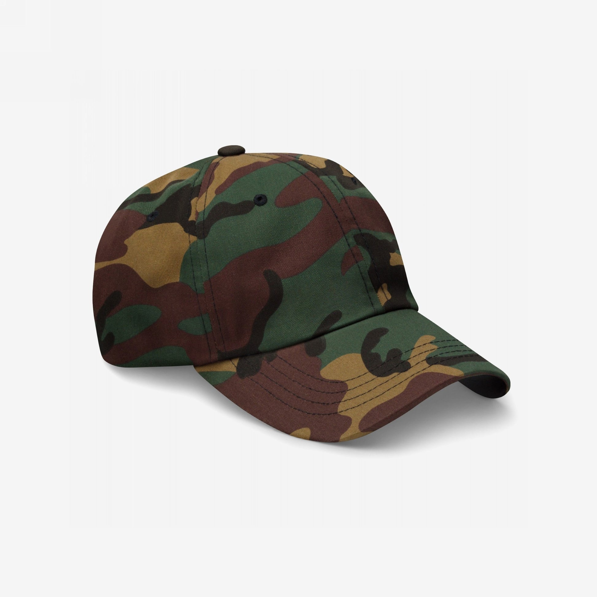 Dad Hat In Custom Colors featuring a woodland camouflage print, showcasing a six-panel design with an adjustable strap and antique buckle, embodying activism and comfort on a plain white background.