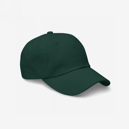 Dad Hat In Custom Colors, shown in forest green, features an unstructured, low-profile design. Made from chino cotton twill with an adjustable strap, it's ideal for displaying your chosen activist embroidery.