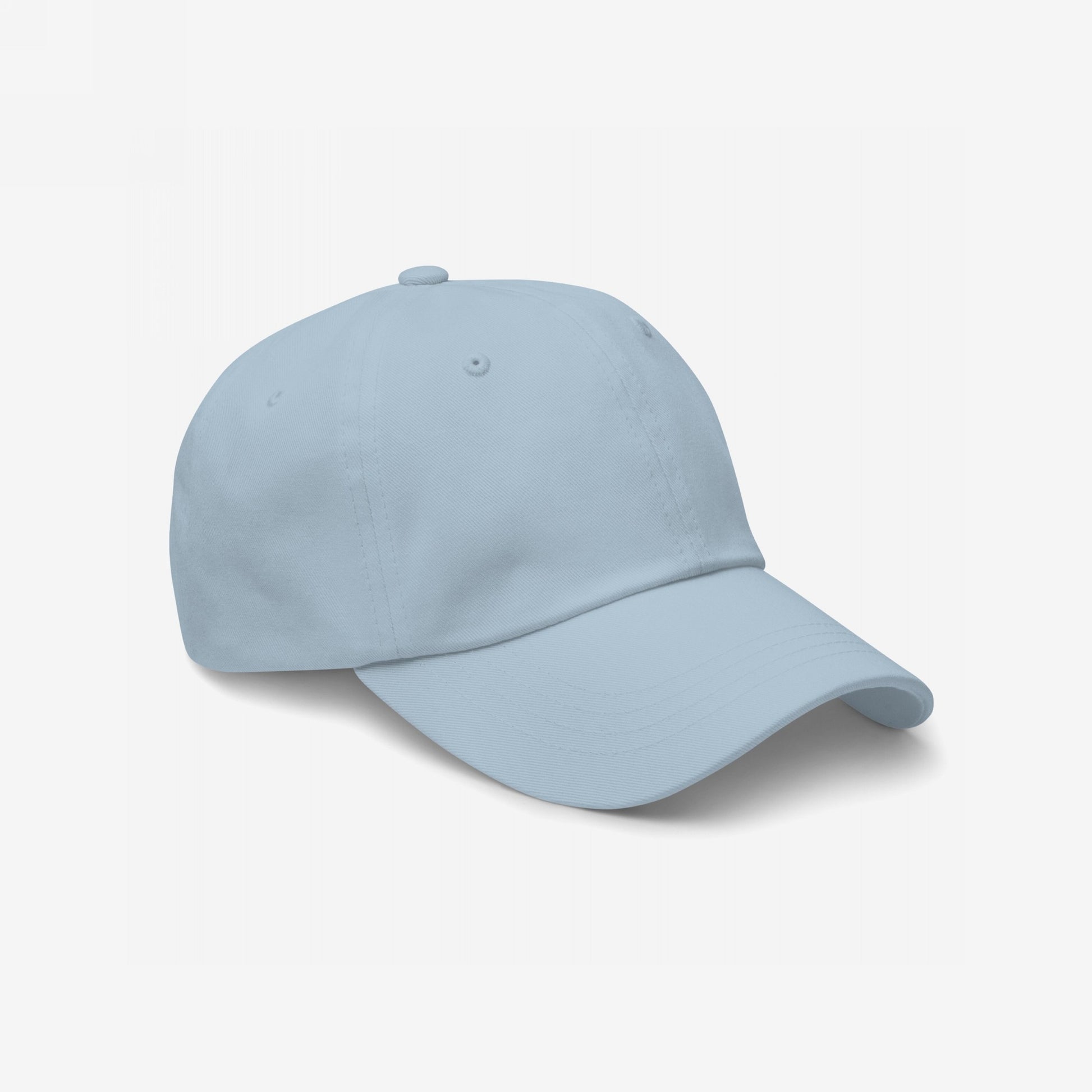 Light-blue Dad Hat In Custom Colors, featuring a six-panel design with a curved brim. This unstructured, adjustable cap offers comfort and customizable embroidered messages supporting activism and equality.