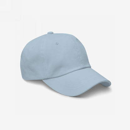 Light-blue Dad Hat In Custom Colors, unstructured with a curved brim and adjustable strap, ready for custom embroidery. Ideal for subtle protests and everyday wear, promoting equality and anti-fascist messages.
