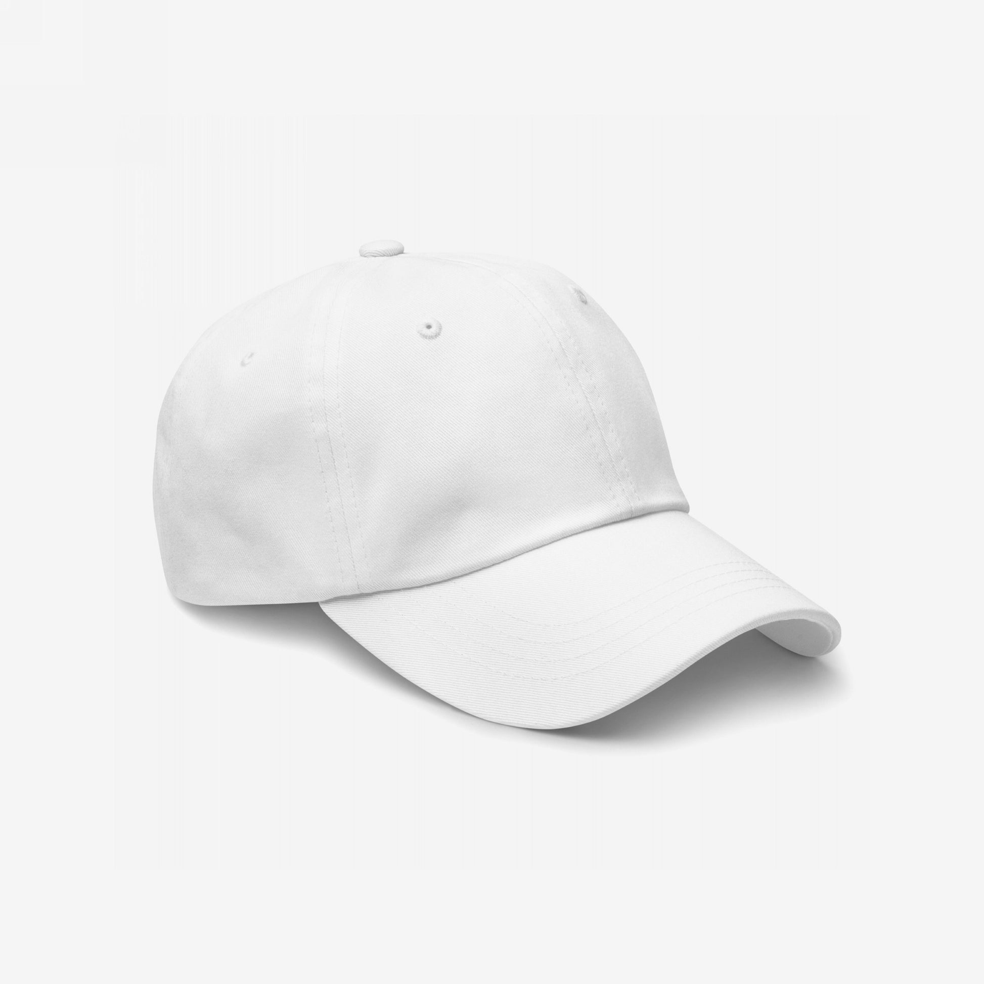 Dad Hat In Custom Colors, a plain white baseball-style cap with a curved brim and adjustable strap, ideal for showcasing anti-fascist embroidery designs, seen at a slight angle on a white background.