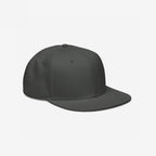 Snapback Hat In Custom Colors: A plain, dark gray six-panel snapback baseball cap with a flat brim, ideal for customizing with embroidered designs to express anti-fascist, anti-racist, or progressive messages.