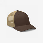 Trucker Hat In Custom Colors with a solid brown front and curved brim, tan mesh back, adjustable snapback, and structured crown. Ideal for bold expressions and personalized embroidery.
