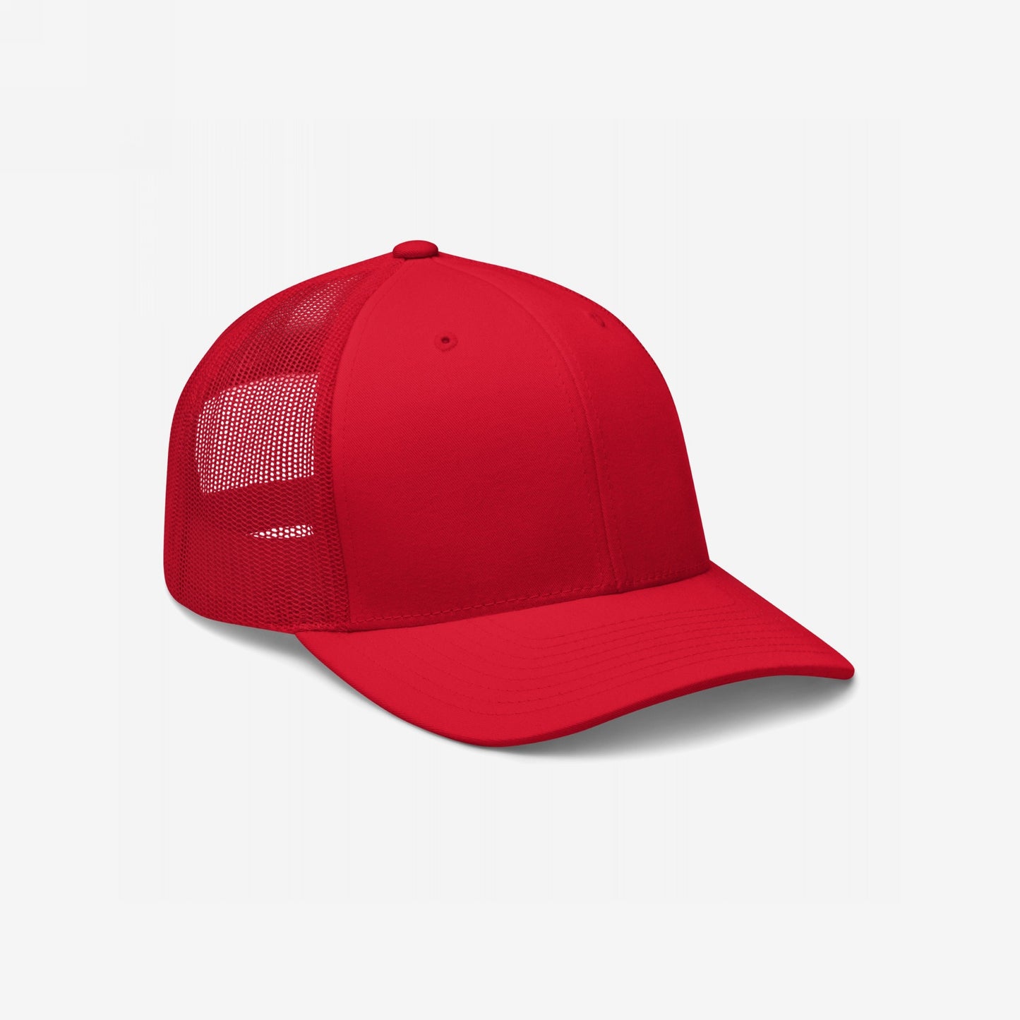 Trucker Hat In Custom Colors features a red structured front and curved brim, complemented by breathable mesh sides and back. Ideal for bold statements with an adjustable snapback, perfect for personalized embroidery.