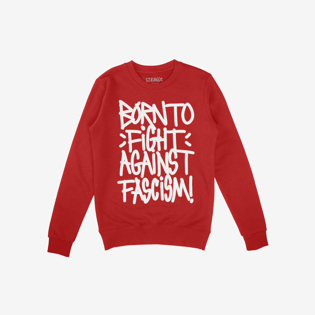 Born To Fight Against Fascism Graffiti Shirt, featuring bold, white graffiti-style lettering on a red crewneck sweatshirt, embodies defiance against tyranny, aligning with values of equality and justice.