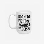 Born To Fight Against Fascism Mug with hand-lettered slogan and raised fist icon, perfect for starting your day with a message of resistance and support for equality and social justice.