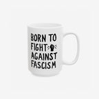 Born To Fight Against Fascism Mug featuring bold, hand-drawn lettering and a graphic of a clenched fist, symbolizing resistance. Perfect for progressives who enjoy strong coffee and stronger politics.
