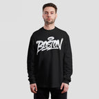 Male model wearing the Boston Handstyle T-shirt, a black long-sleeve featuring bold white graffiti-style BOSTON lettering across the chest, embodying the city's spirit and individuality.