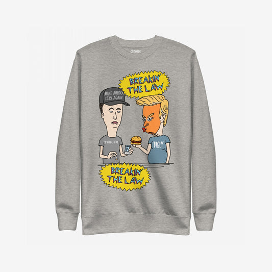 Breakin' The Law Sweatshirt features a satirical cartoon with Trump and Musk-inspired characters, humorously critiquing political figures. Ideal for those challenging authority with bold, rebellious style.