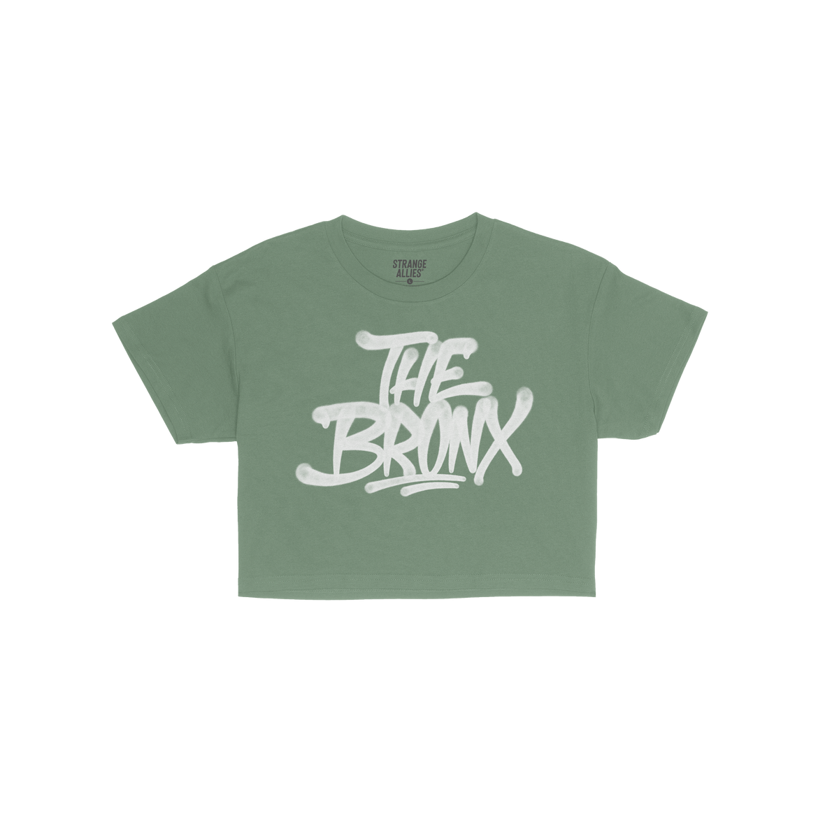 Bronx Handstyle Women's Baby Tee features “THE BRONX” in bold, graffiti-style script on a green short-sleeve shirt, embod