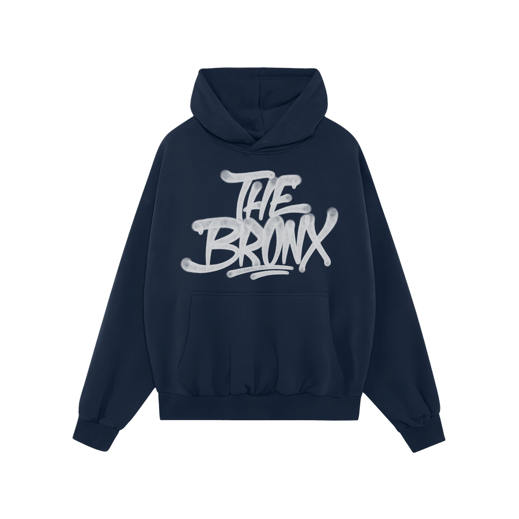 Bronx Handstyle Hoodie, black with a graffiti-style “THE BRONX” print. Features kangaroo pocket and drawstring hood; embo